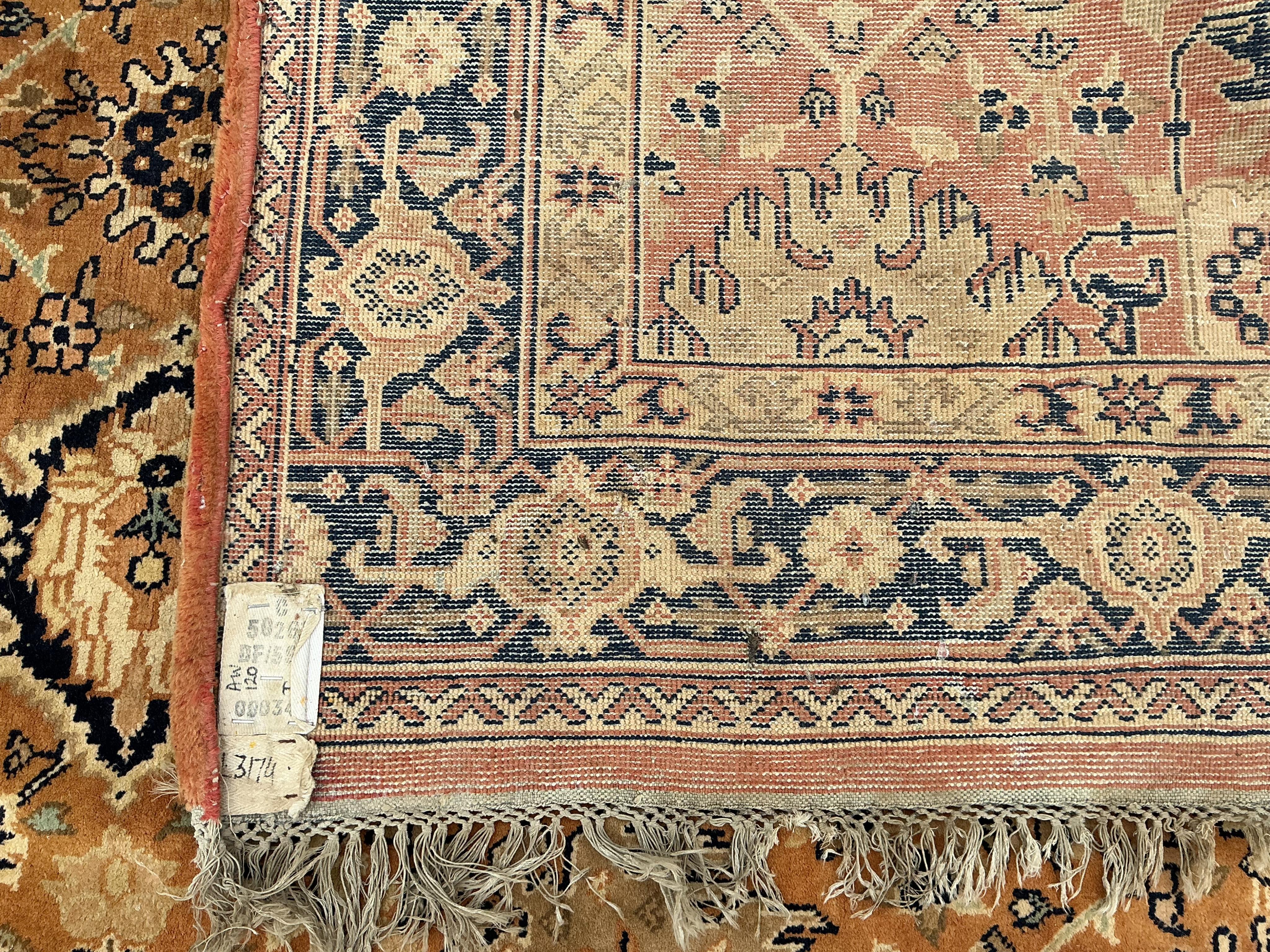 A North West Persian style peach ground carpet, 230 x 168cm
